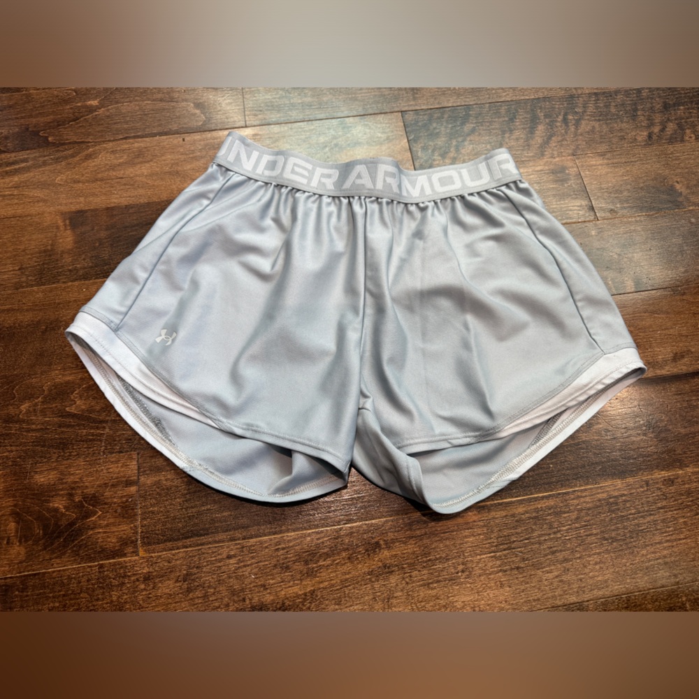 Under armour size small grey loose shorts with a small bit of white
